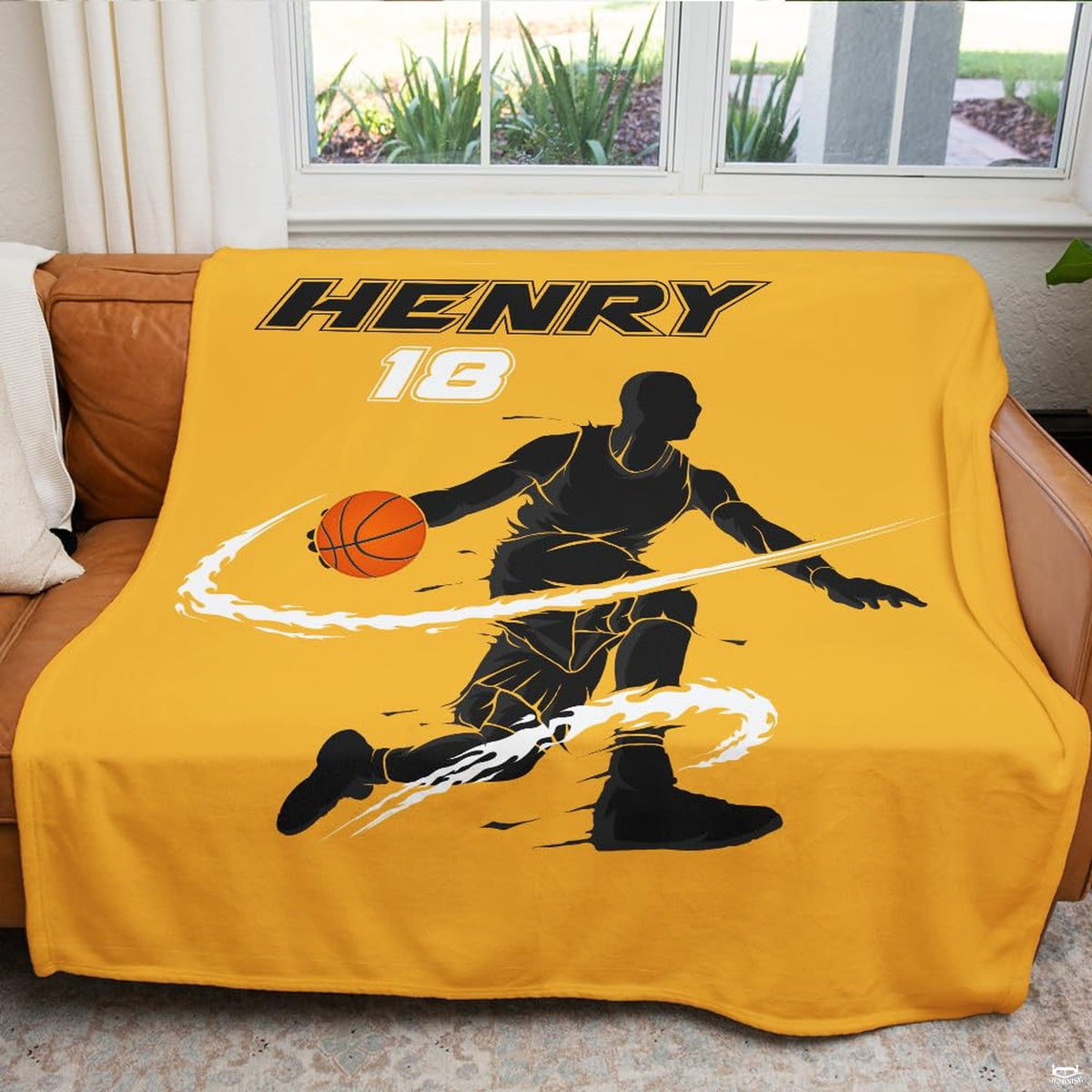 Vibrant sports fan room setting featuring yellow basketball throw blanket on couch