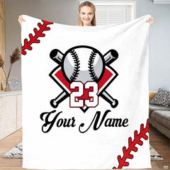 Baseball blanket featuring flame and water graphic spread evenly over a bedroom bed.