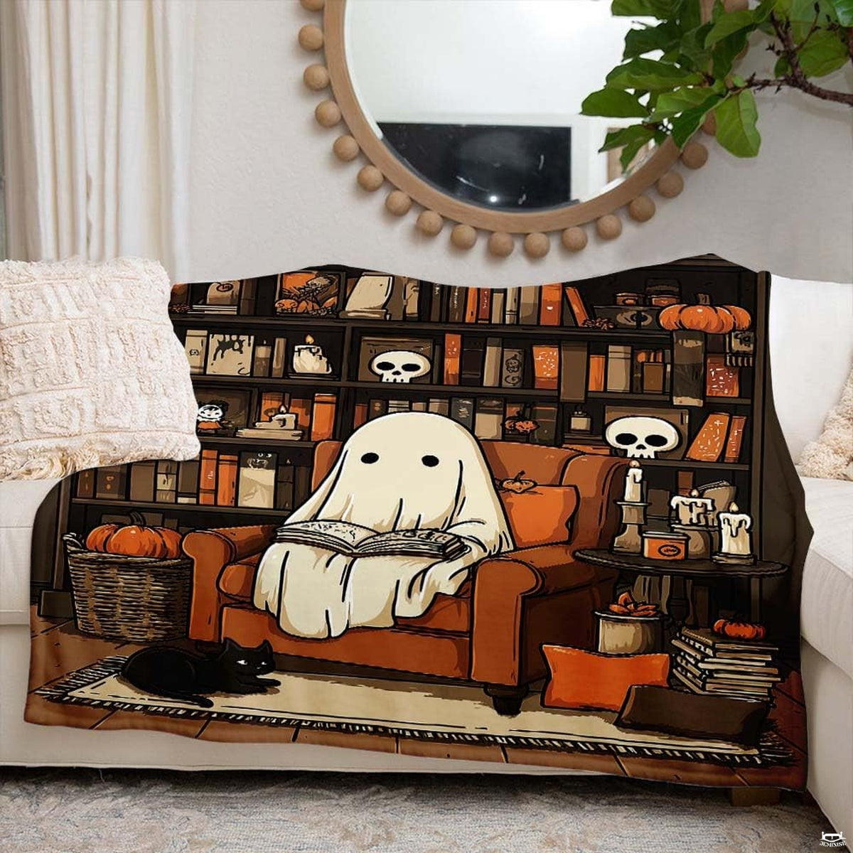 Overhead view of seasonal bedroom decor highlighted by ghost reading illustration on bedding set.