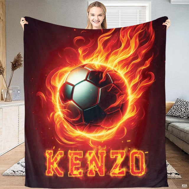 Flaming soccer ball athletic fire art blanket held up by woman