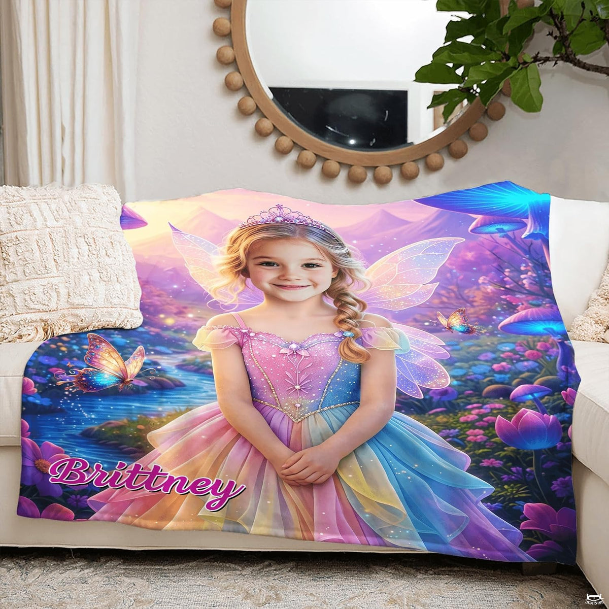 Full spread view of fairytale wonderland blanket showing meadow, stream, and mountain backdrop.