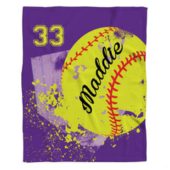 Front full perspective of purple softball throw blanket showing yellow ball and splatter artwork over home plate
