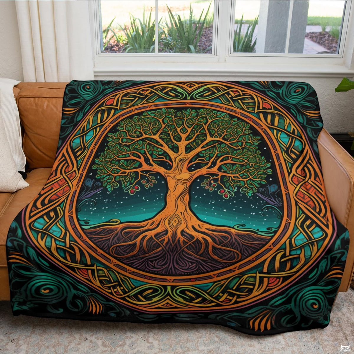 Overhead view of tree of life bedsheet design with balanced circular ribbons and celestial accents.