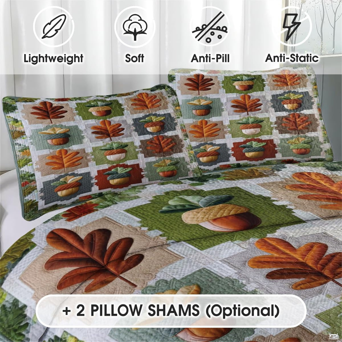 Close-up detail of pumpkin patchwork bedding displaying stylized oak leaves, acorns, and pumpkin orange accents.