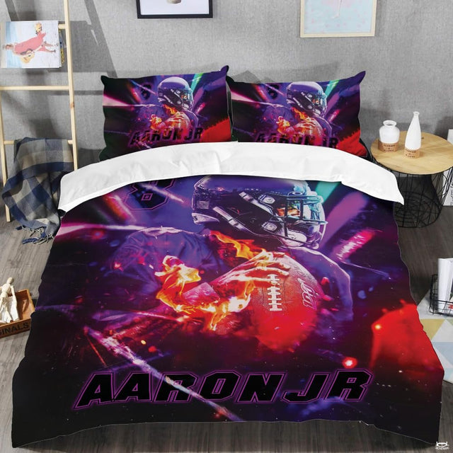 Close-up perspective of football bedding detailing amethyst yard lines, crisp white lacing, and bold typography