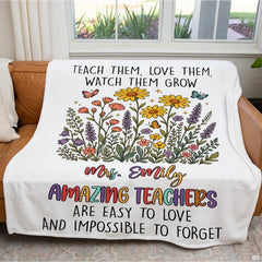 Full overhead display of teacher appreciation wildflower throw blanket on light wooden floor