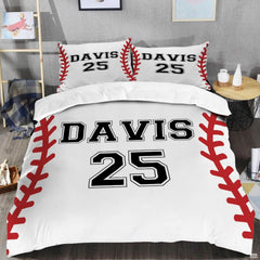 Close view of baseball sports motif detailing curved red seams and crisp textured white graphics on bedding.