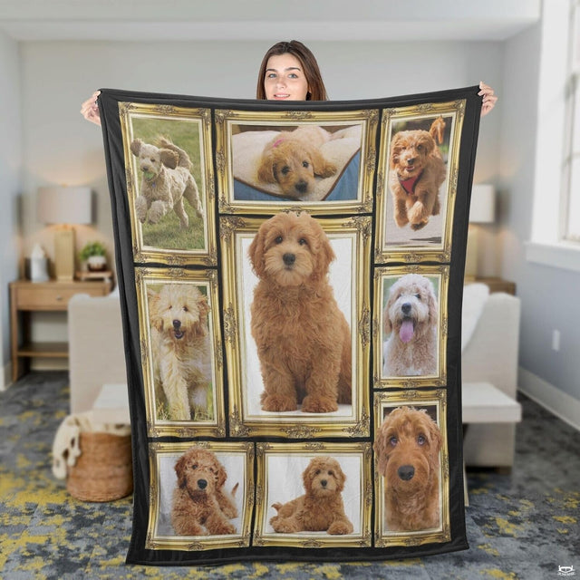 Folded canine photo gallery throw blanket showing multiple gold-framed puppy portraits