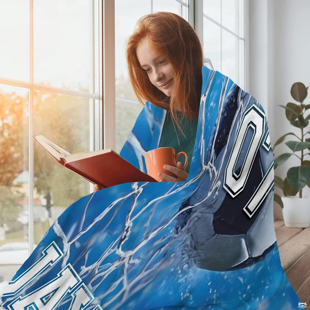 Action soccer visual with water droplets and net motion graphics displayed on bedroom bedding.