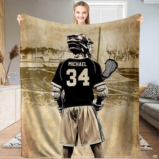 Vintage sepia lacrosse player graphic blanket held upright by model