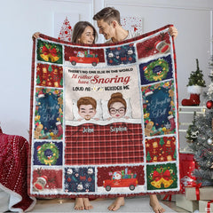 Christmas holiday couple plaid throw blanket displaying a cartoon couple in bed framed by holiday patchwork squares