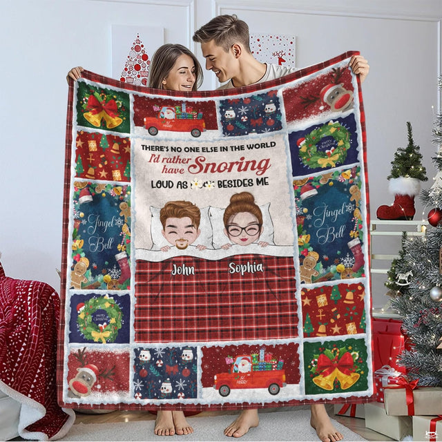 Christmas holiday couple plaid throw blanket displaying a cartoon couple in bed framed by holiday patchwork squares