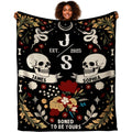 Gothic floral skulls blanket featuring paired skulls, celestial serpents, and crimson blooms.