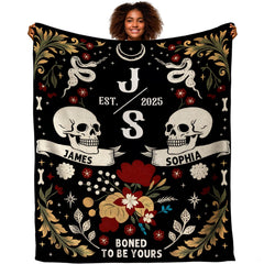 Gothic floral skulls blanket featuring paired skulls, celestial serpents, and crimson blooms.