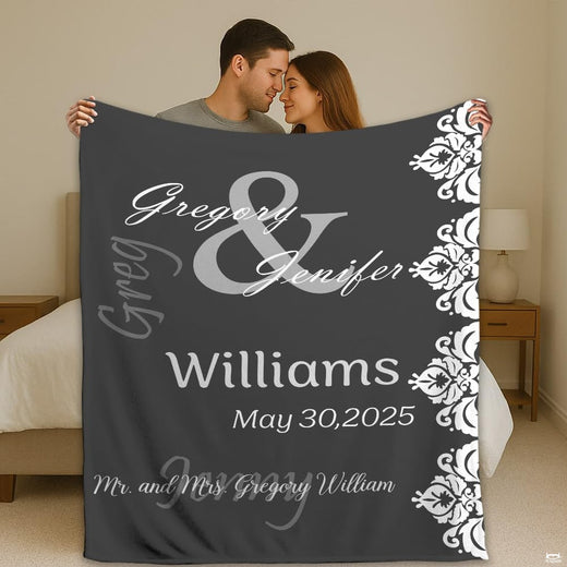Mr and Mrs damask lace wedding throw blanket held open by couple