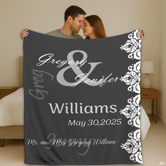 Mr and Mrs damask lace wedding throw blanket held open by couple