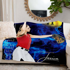 Blue smoke athletic pitcher graphic styled across a white couch beneath a circular mirror.