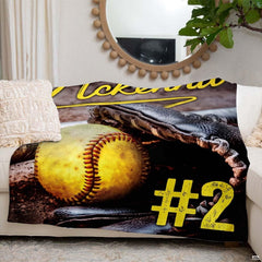 Fastpitch softball artwork blanket styled across couch sofa