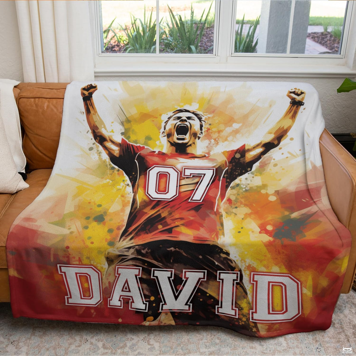 Vibrant sports theme bedding set showing athletic goal celebration artwork with fiery splatters.