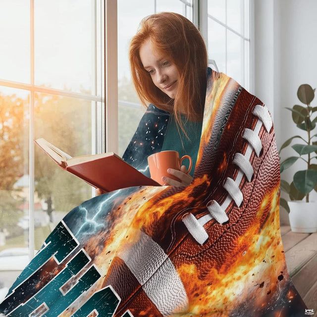 Athletic decor showing a fiery football graphic with bold collegiate jersey numbers and starry nebula backdrop.