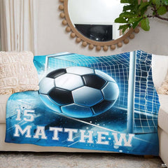 Living room couch arrangement highlighting the complete blue watercolor soccer graphic print.