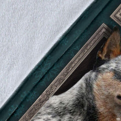 Close-up detail shot of the Australian Cattle Dog blanket showing edge detail and teal snowflake art.