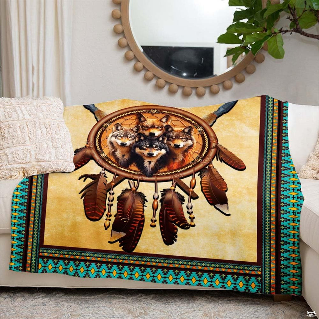 Bedding set corner detail displaying painted tribal borders and beaded dreamcatcher illustration.