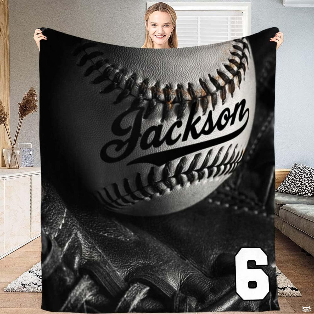 Monochrome studio still-life of a baseball inside a black fielder glove with dramatic lighting, view 2.