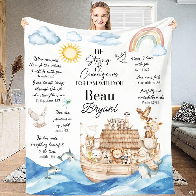 Storybook animal ark artwork with rainbow and ocean waves held open in a bright room