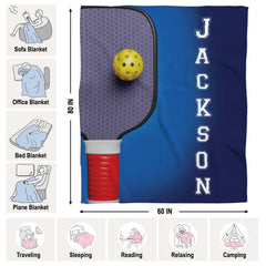 Honeycomb pickleball paddle with yellow ball on blue gradient, view 4.