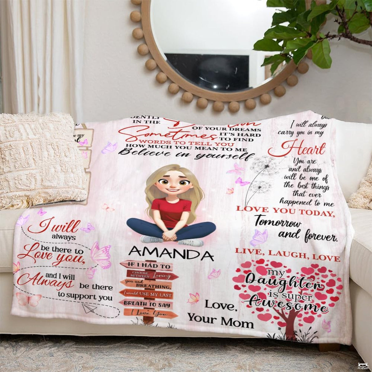 Living room sofa scene showing the decorative cartoon throw blanket draped over furniture.