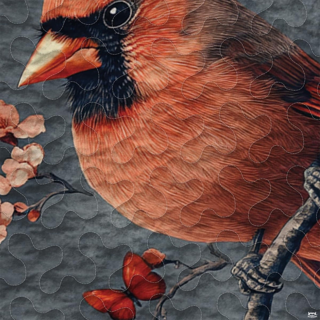 Close-up perspective of cardinal bedding highlighting scarlet red bird plumage, pine needles, and frosted boughs
