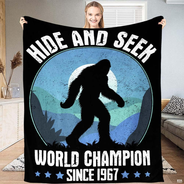 Distressed vintage hide and seek Bigfoot graphic with mountain badge and typography, view 1.