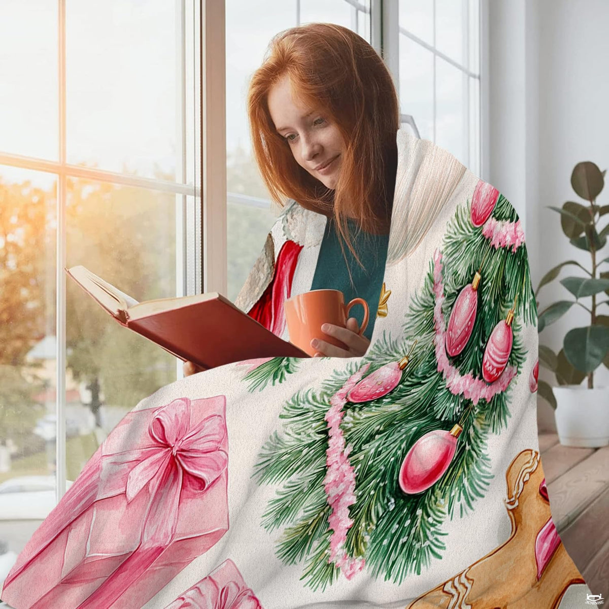 Festive pink Christmas bedding highlighting decorated green tree and wrapped present illustrations.