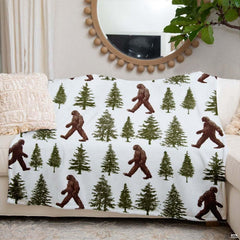 Sasquatch bed spread motif showcasing evergreen pines and Bigfoot silhouettes in rustic style.
