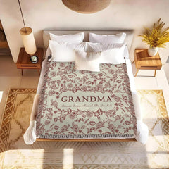 Full layout of vintage floral toile design with multicolored fringe trim on Blanket.