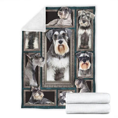 Folded corner and rolled layout of the Miniature Schnauzer blanket showing the white reverse side.