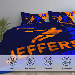 Corner fold view of basketball bedding highlighting vivid orange and cobalt blue printing against dark navy