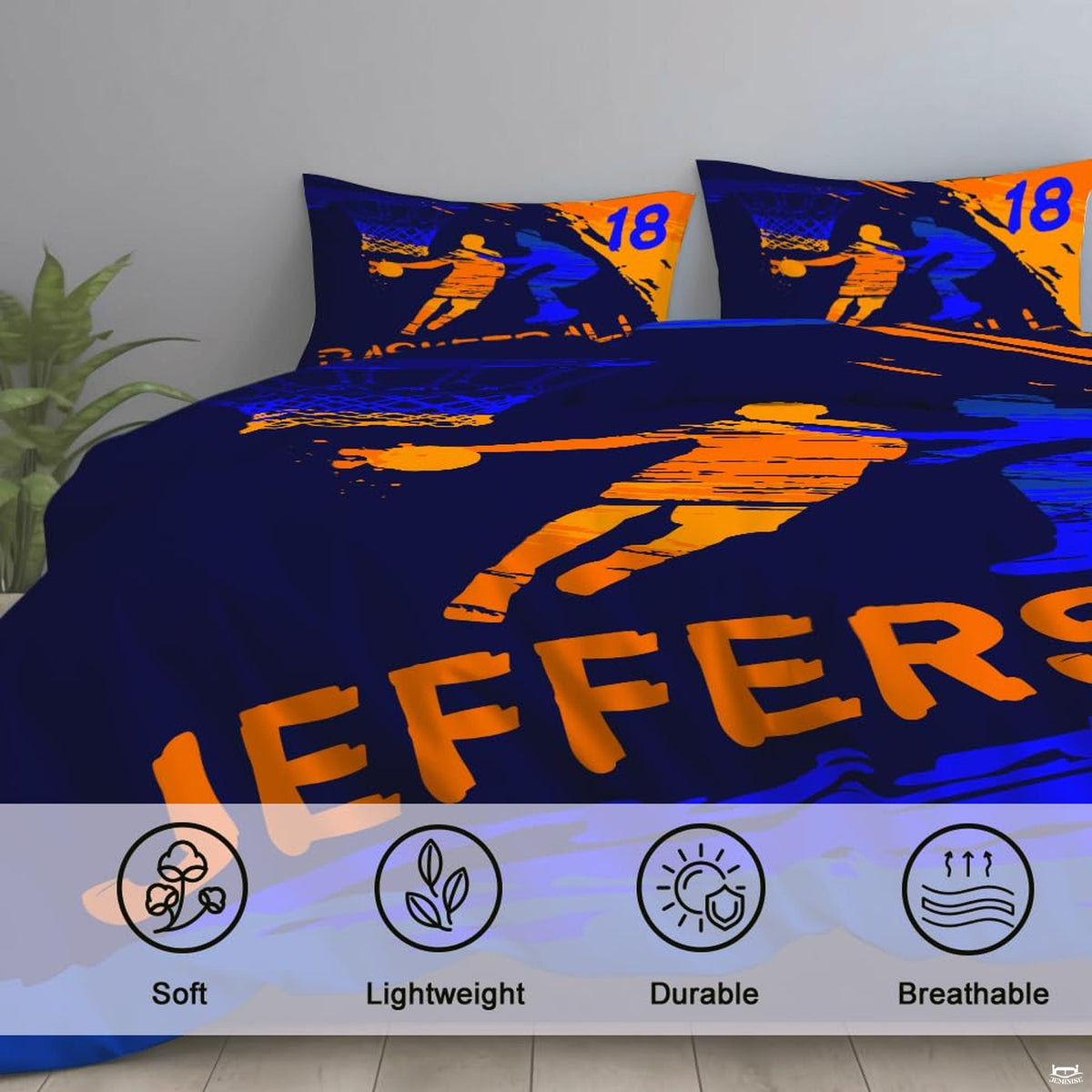 Corner fold view of basketball bedding highlighting vivid orange and cobalt blue printing against dark navy