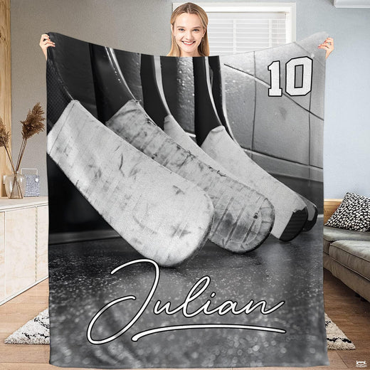 Ice hockey sticks locker room throw blanket held open by woman