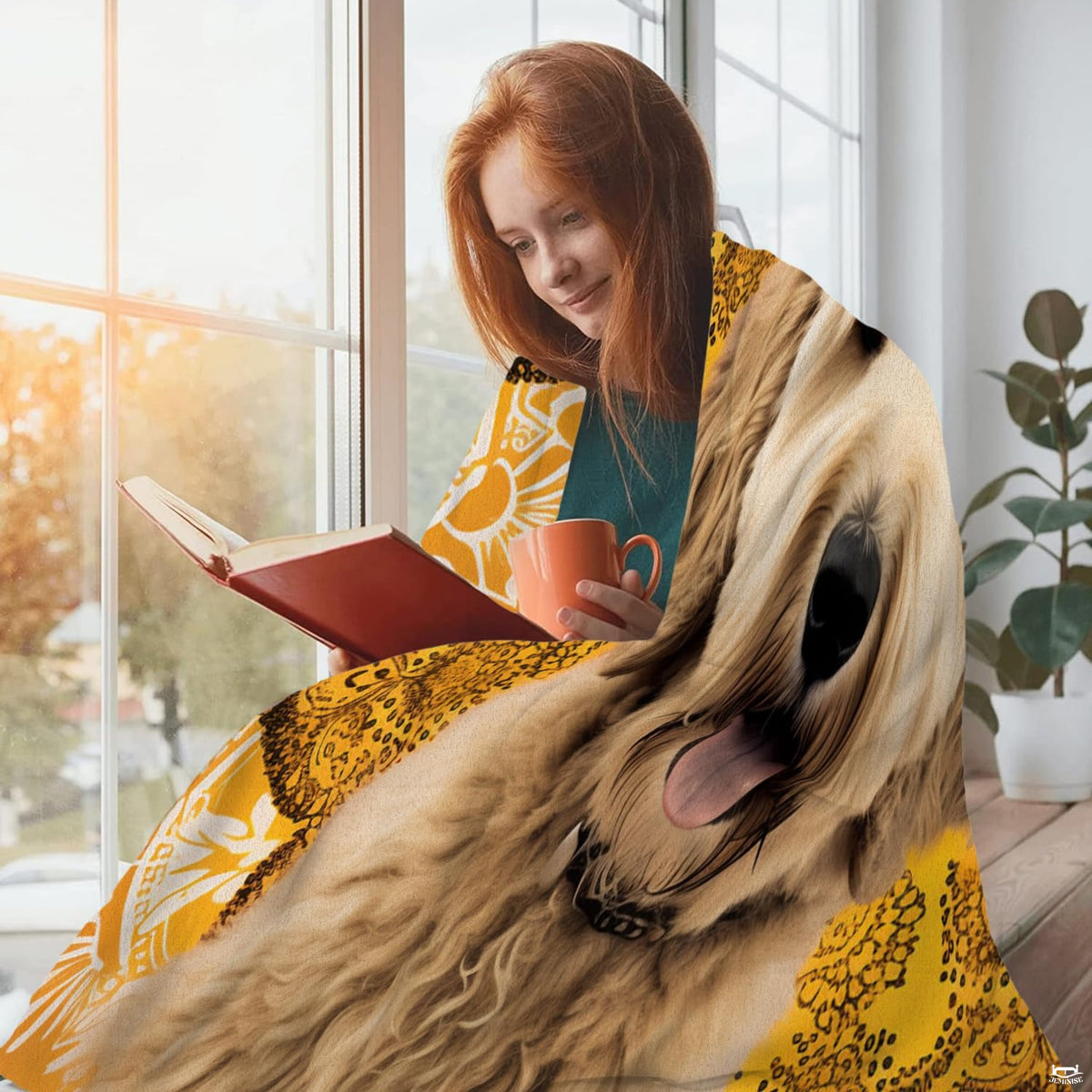 Close view of smiling golden doodle face and amber mandala lace on blanket