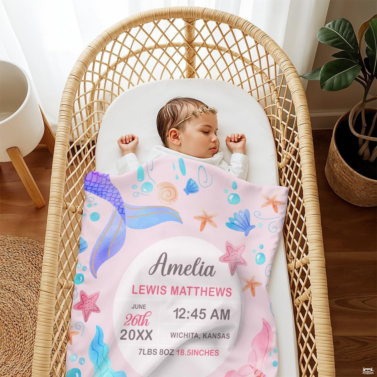 Watercolor mermaid artwork blanket folded on nursery armchair