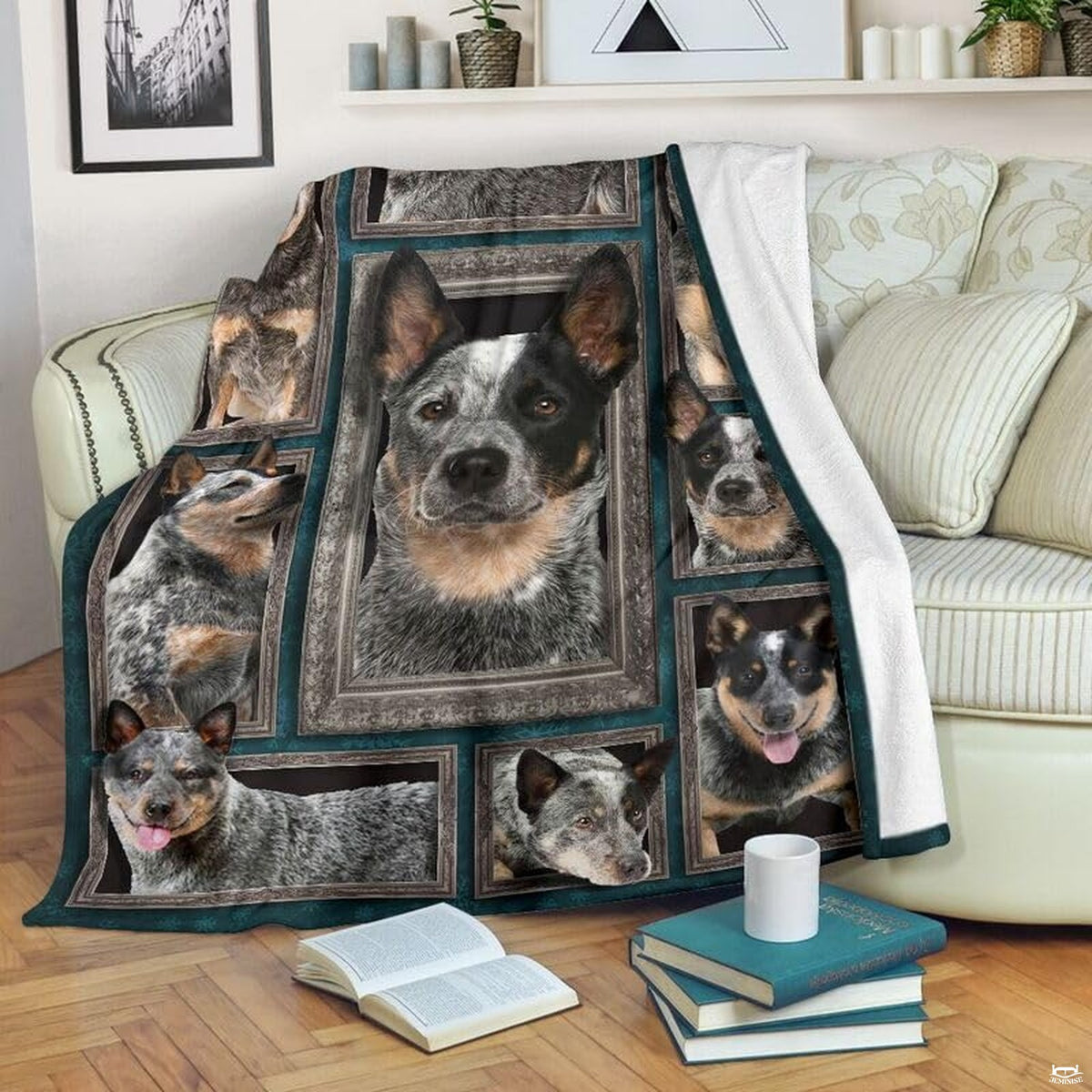 Australian Cattle Dog blanket draped over an armchair displaying framed dog portraits on a teal background.