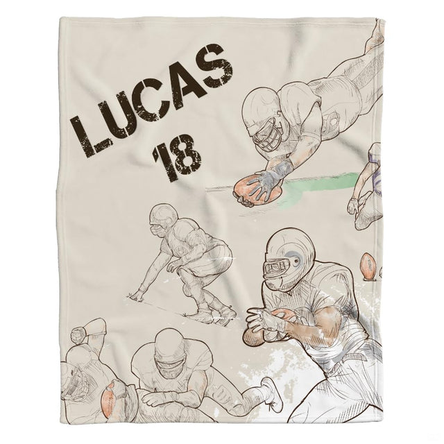 Flat view of football blanket displaying hand-drawn player action sketches and distressed typography on beige