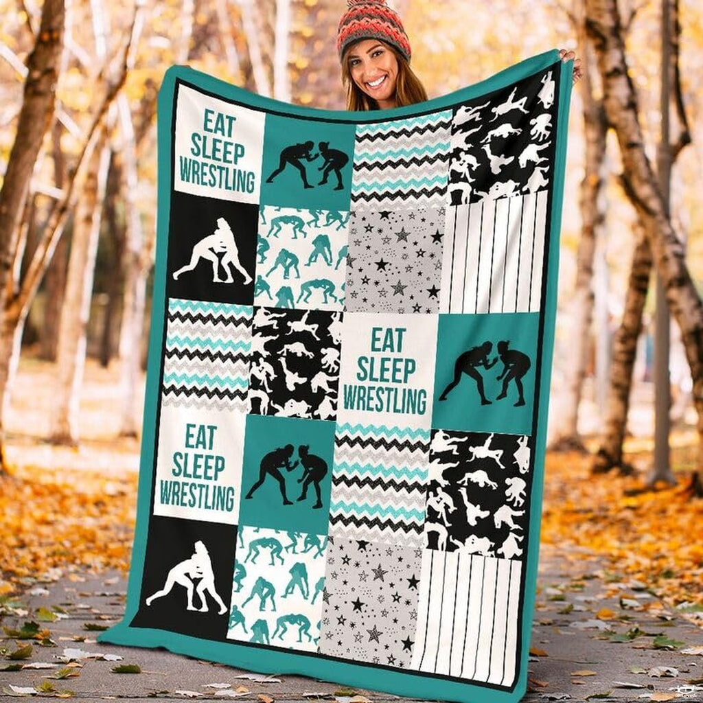 Close up view of wrestler silhouette blocks, star patterns, and teal chevron stripes.