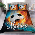 Fire and water soccer sports bedding featuring a soccer ball between splashing water and flames on a bed