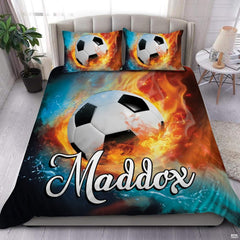 Fire and water soccer sports bedding featuring a soccer ball between splashing water and flames on a bed