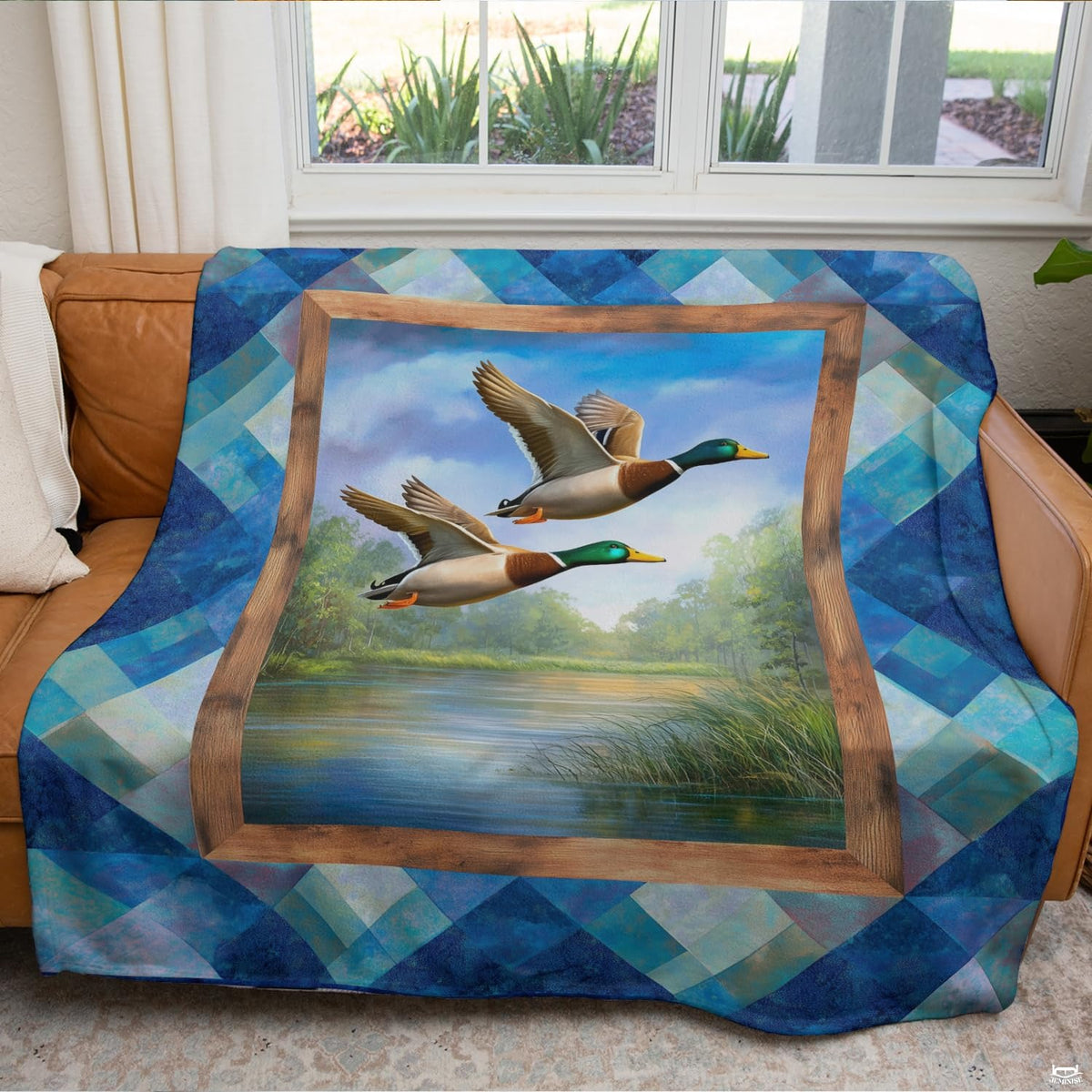 Scenic lake landscape with mallards in flight printed across rustic lodge decor bedding presentation.
