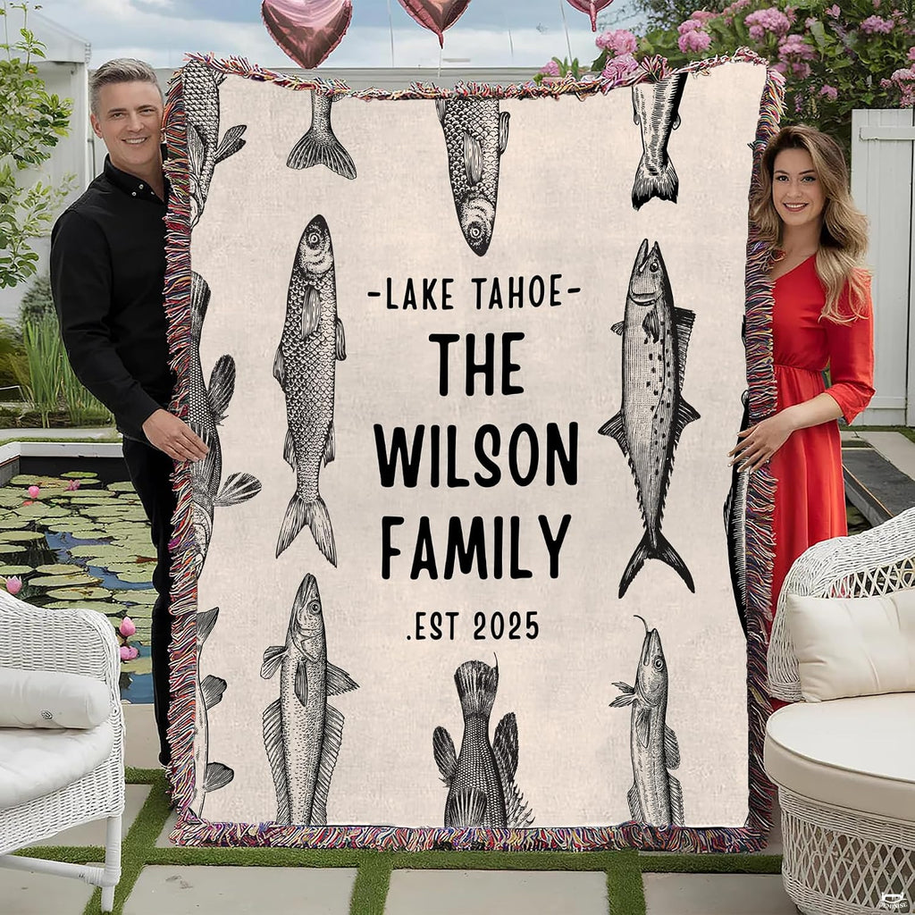 Vintage fish engraving throw blanket view 2 styled on living room couch in modern home
