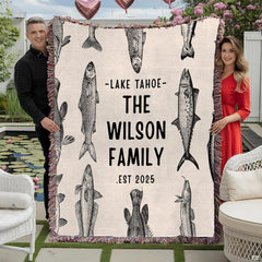 Vintage fish engraving throw blanket view 2 styled on living room couch in modern home